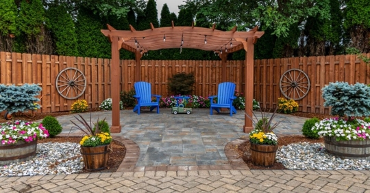 Wooden pergola on pavers landscape design