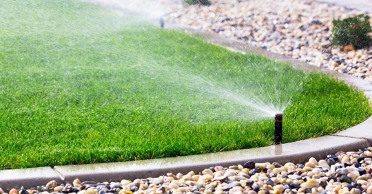 Automatic sprinklers watering lawn
